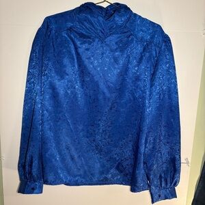 Elegant Vintage Blue Floral Blouse with unique neck design and buttons.